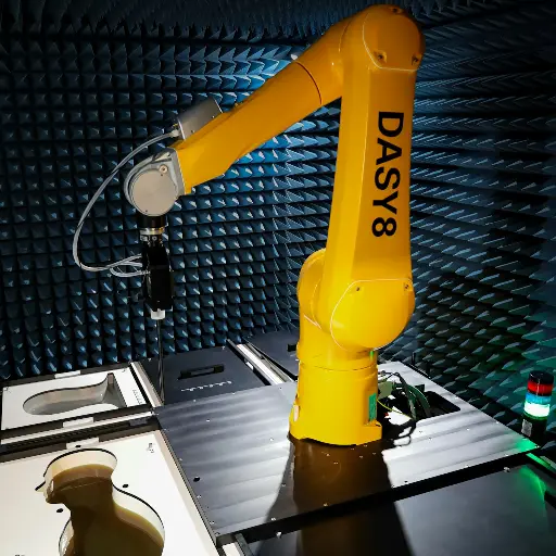 a yellow robot sitting on top of a table